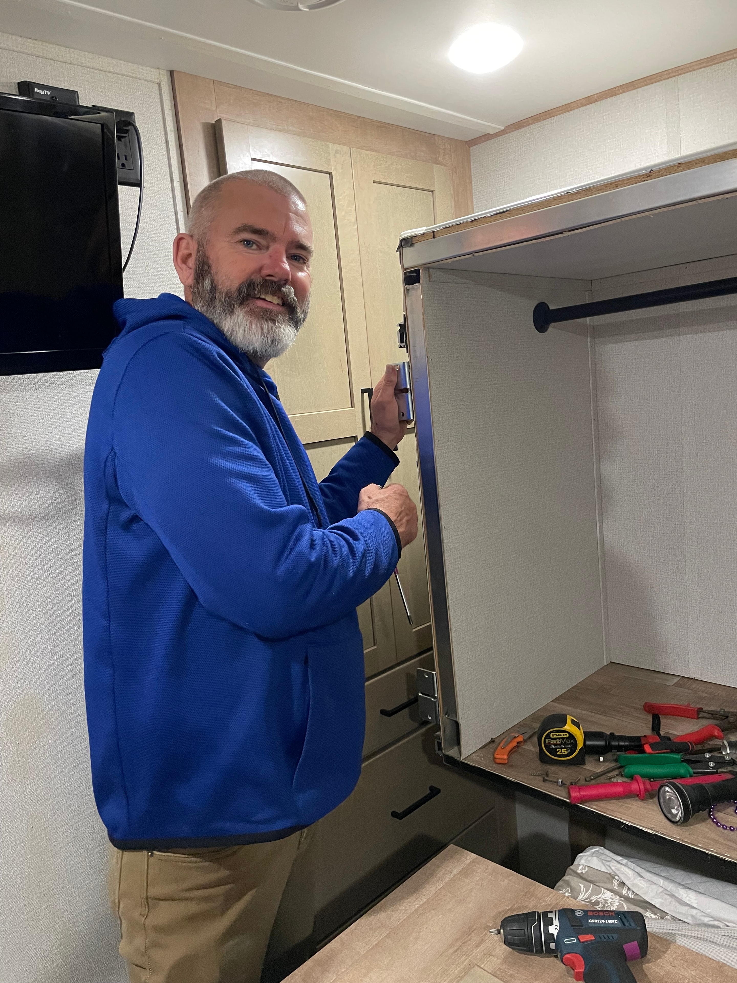 Technician working on RV slide-out interior